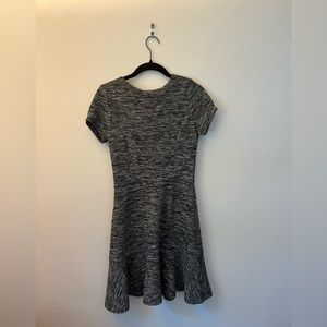 Grey stretchy mid-thigh length dress with peplum bottom